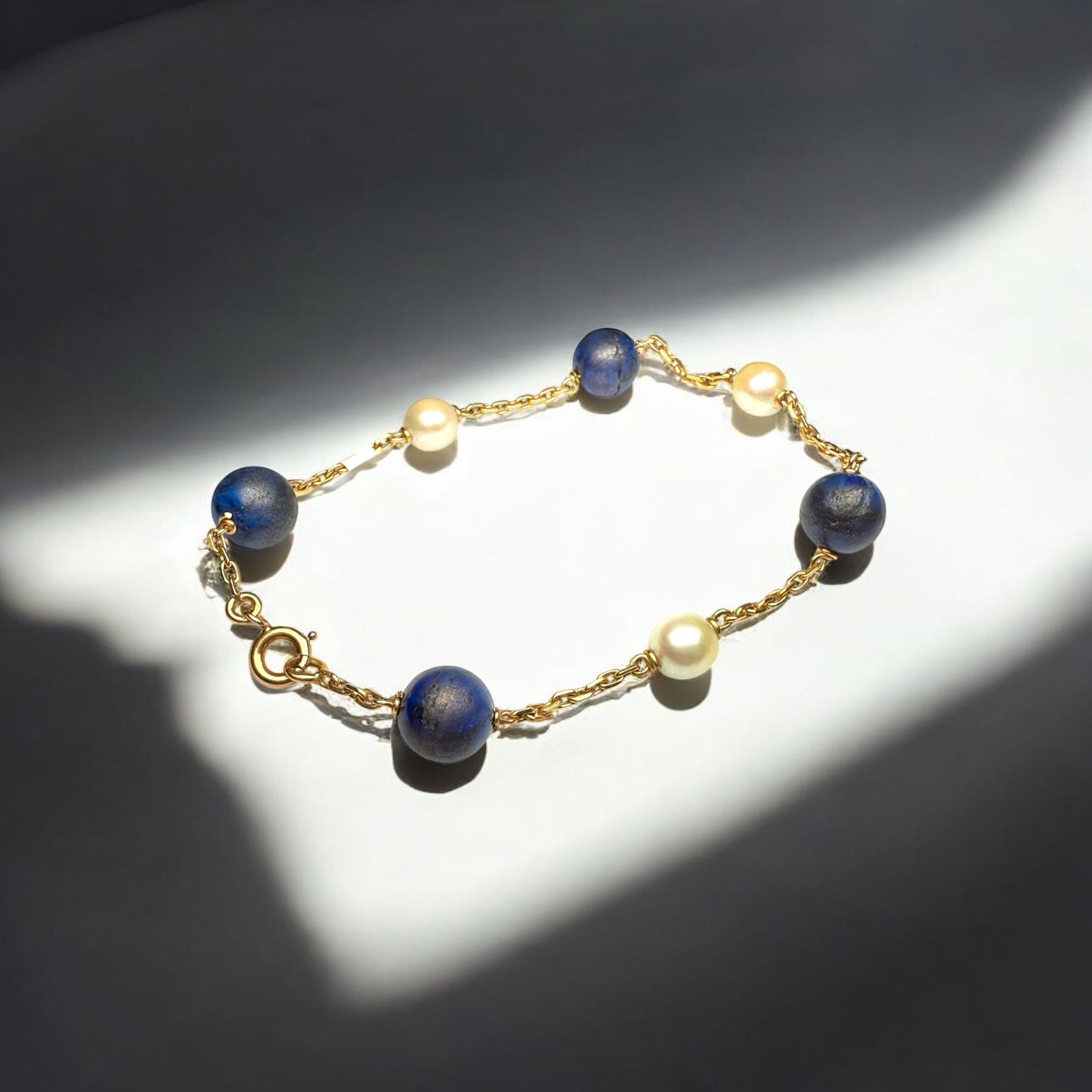 Lapis and pearl gold bracelet