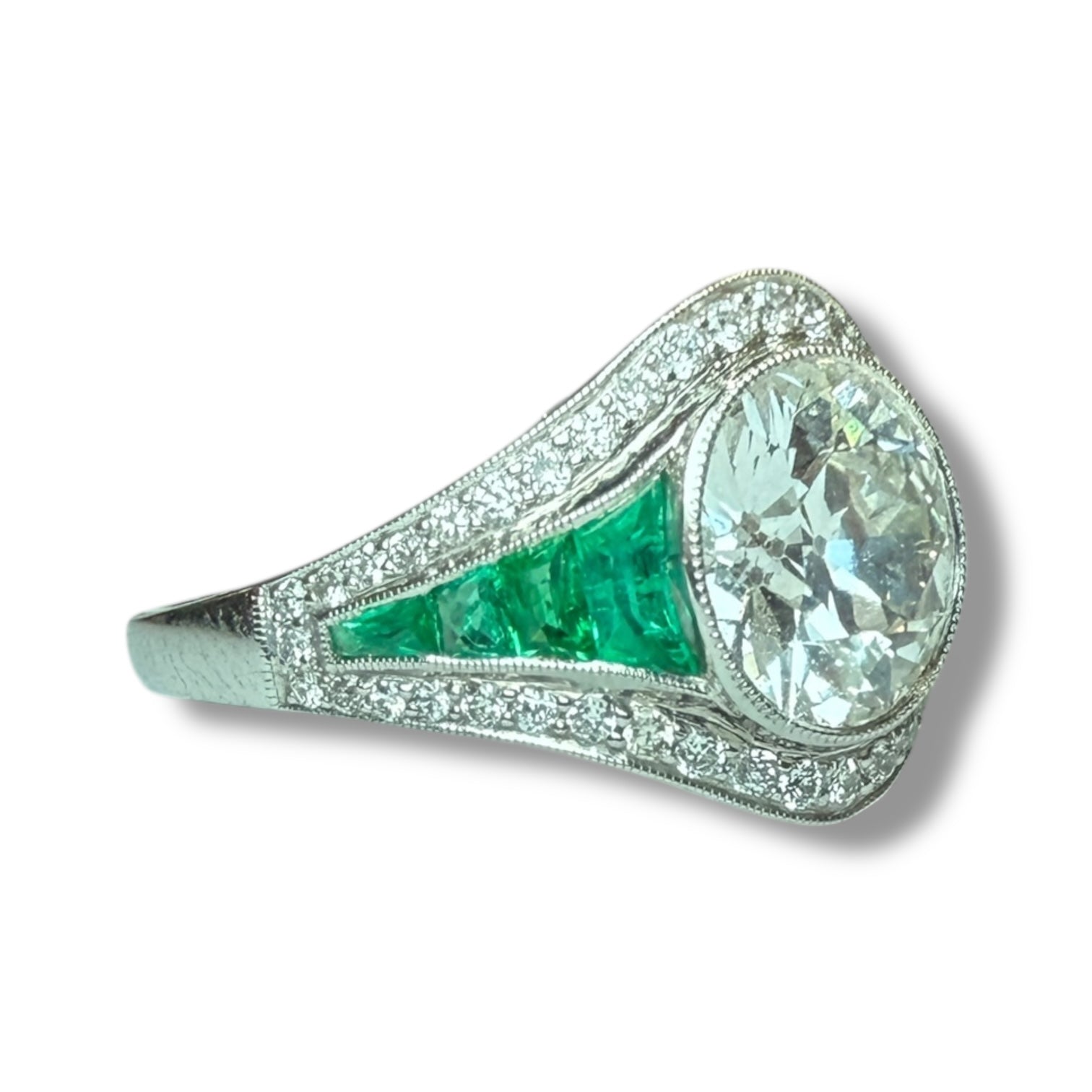 Diamond and emerald engagement ring