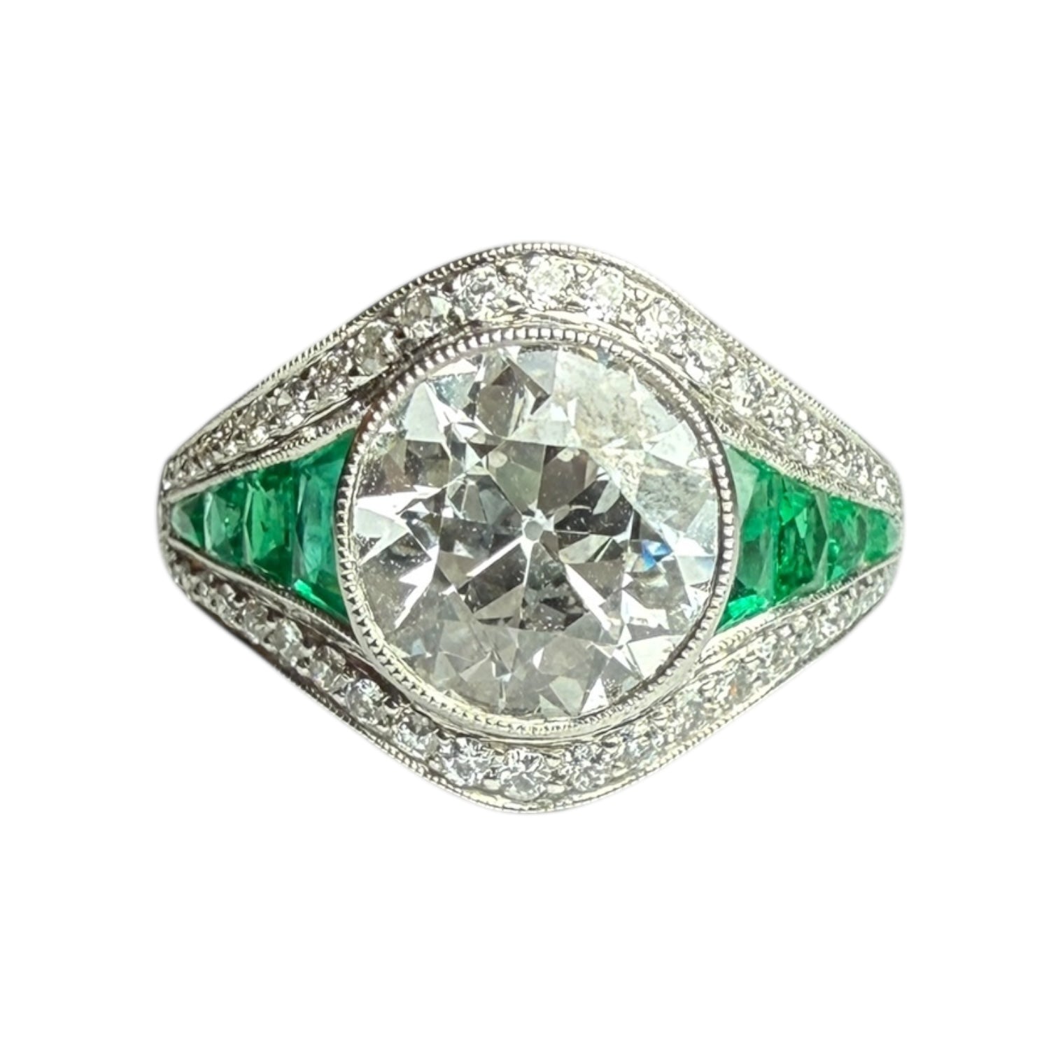 Diamond and emerald engagement ring