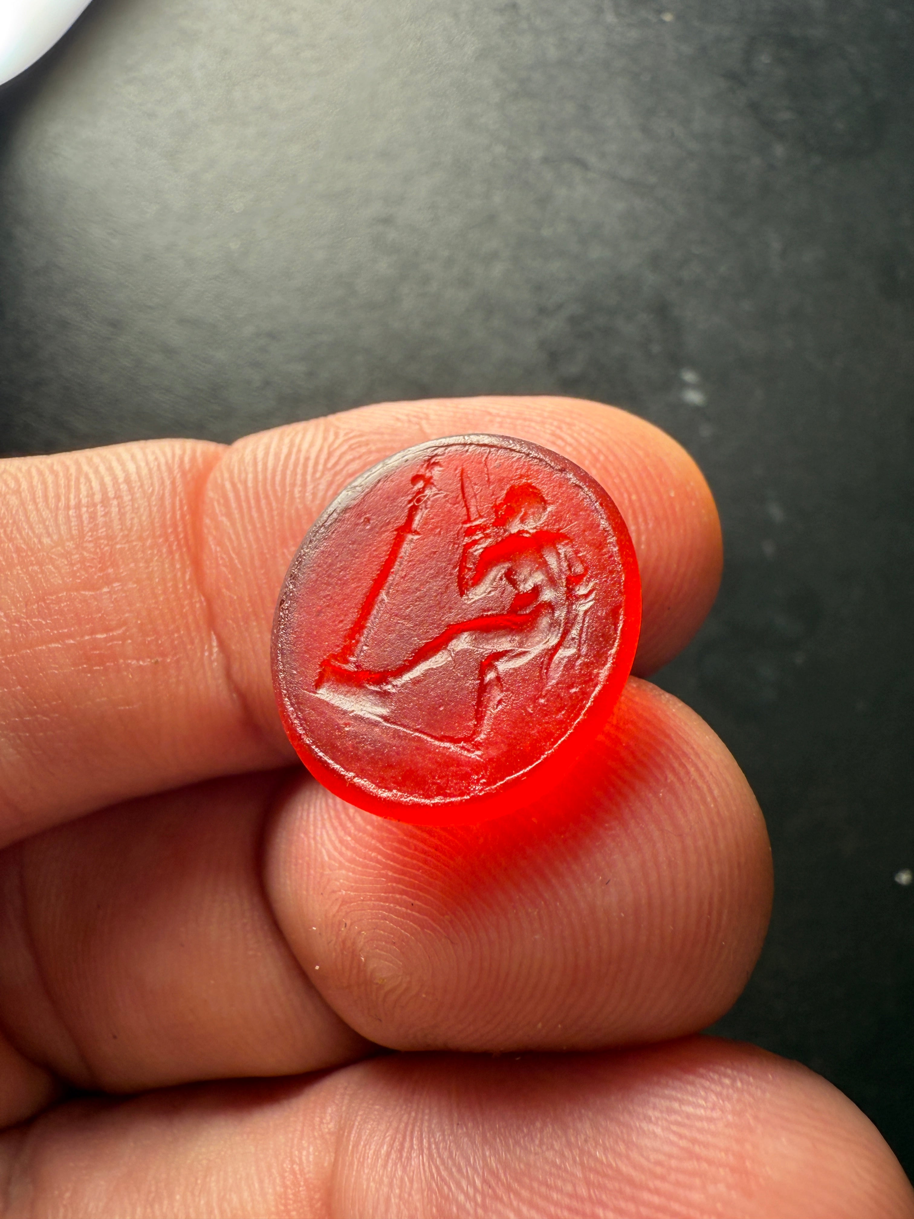 Antique Red Glass Intaglio – Warrior Offering at an Altar
Dimensions: 1.6 x 1.9 cm