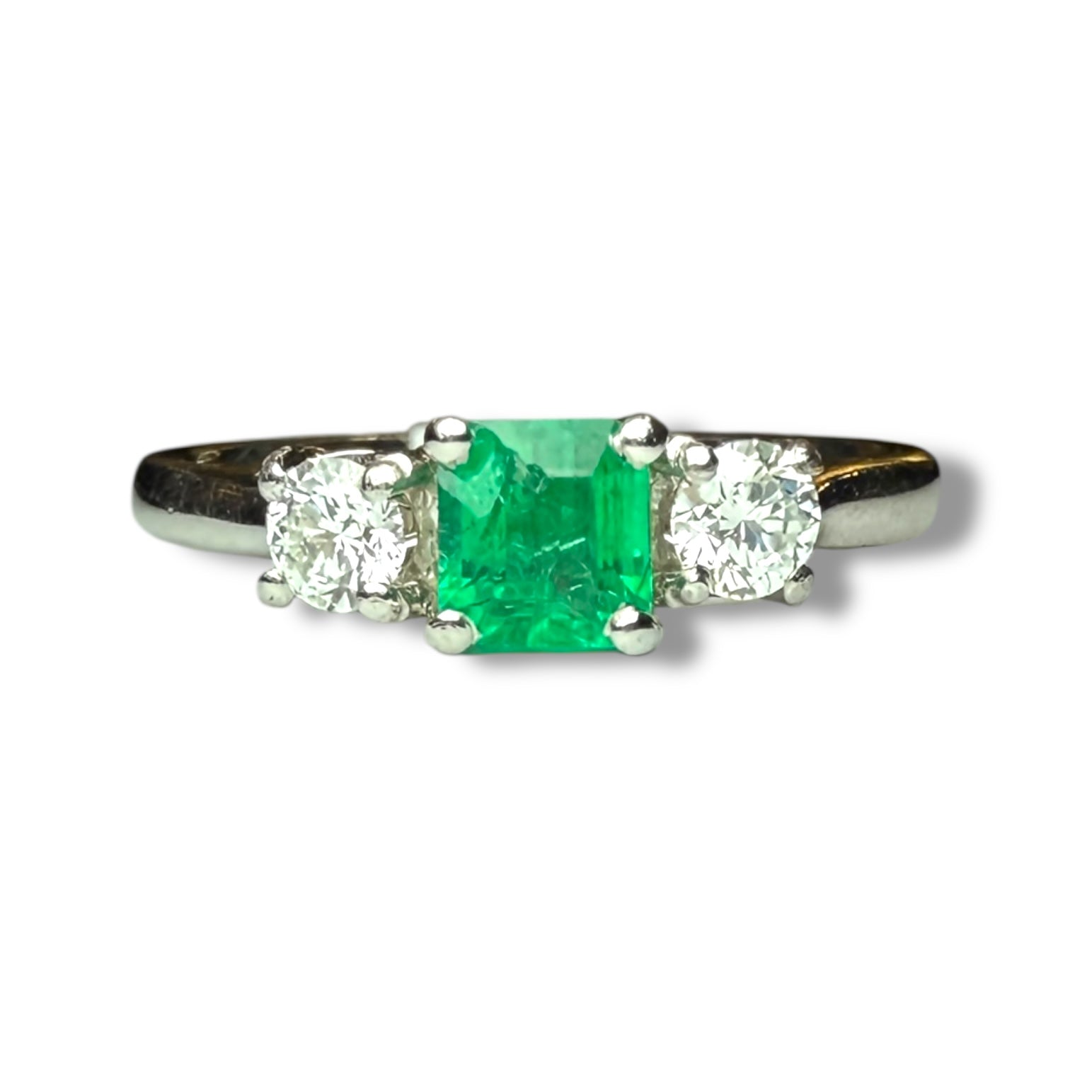 Emerald and diamond engagement ring