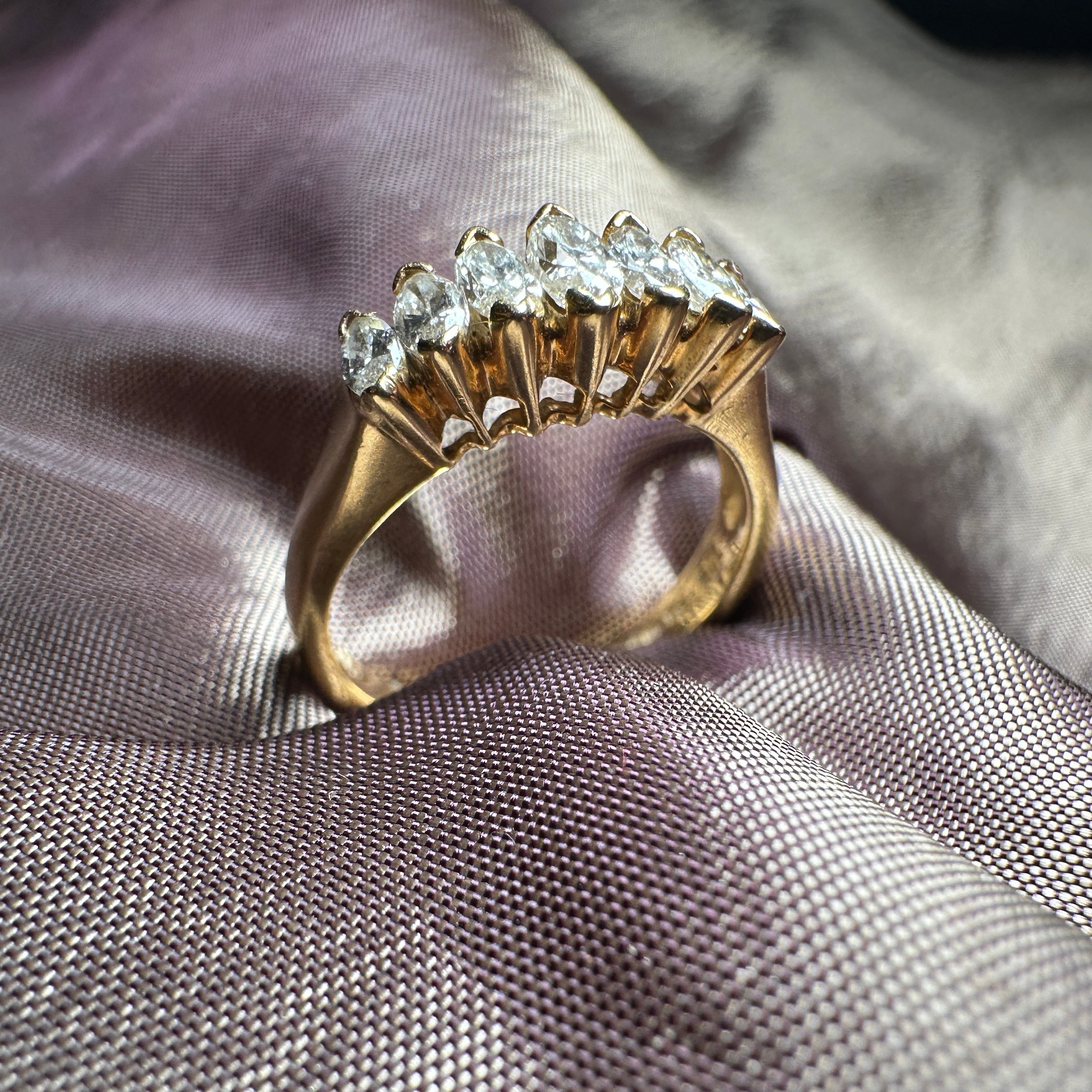 18-carat gold ring featuring seven marquise-cut diamonds