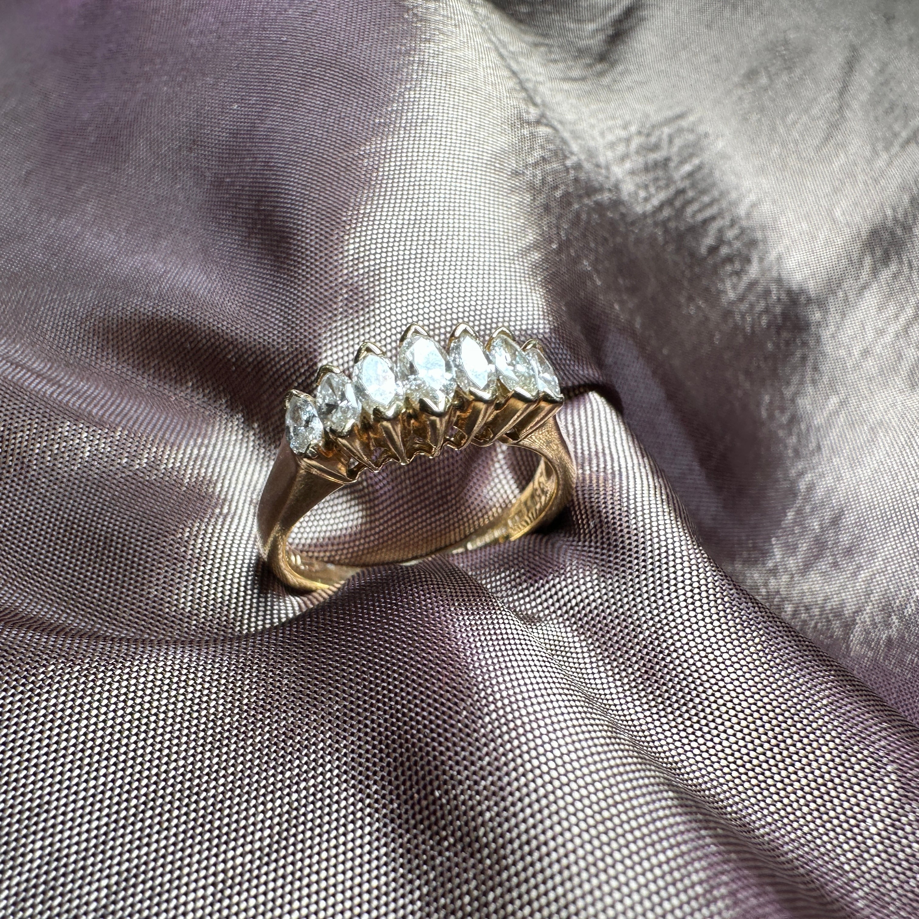 18-carat gold ring featuring seven marquise-cut diamonds