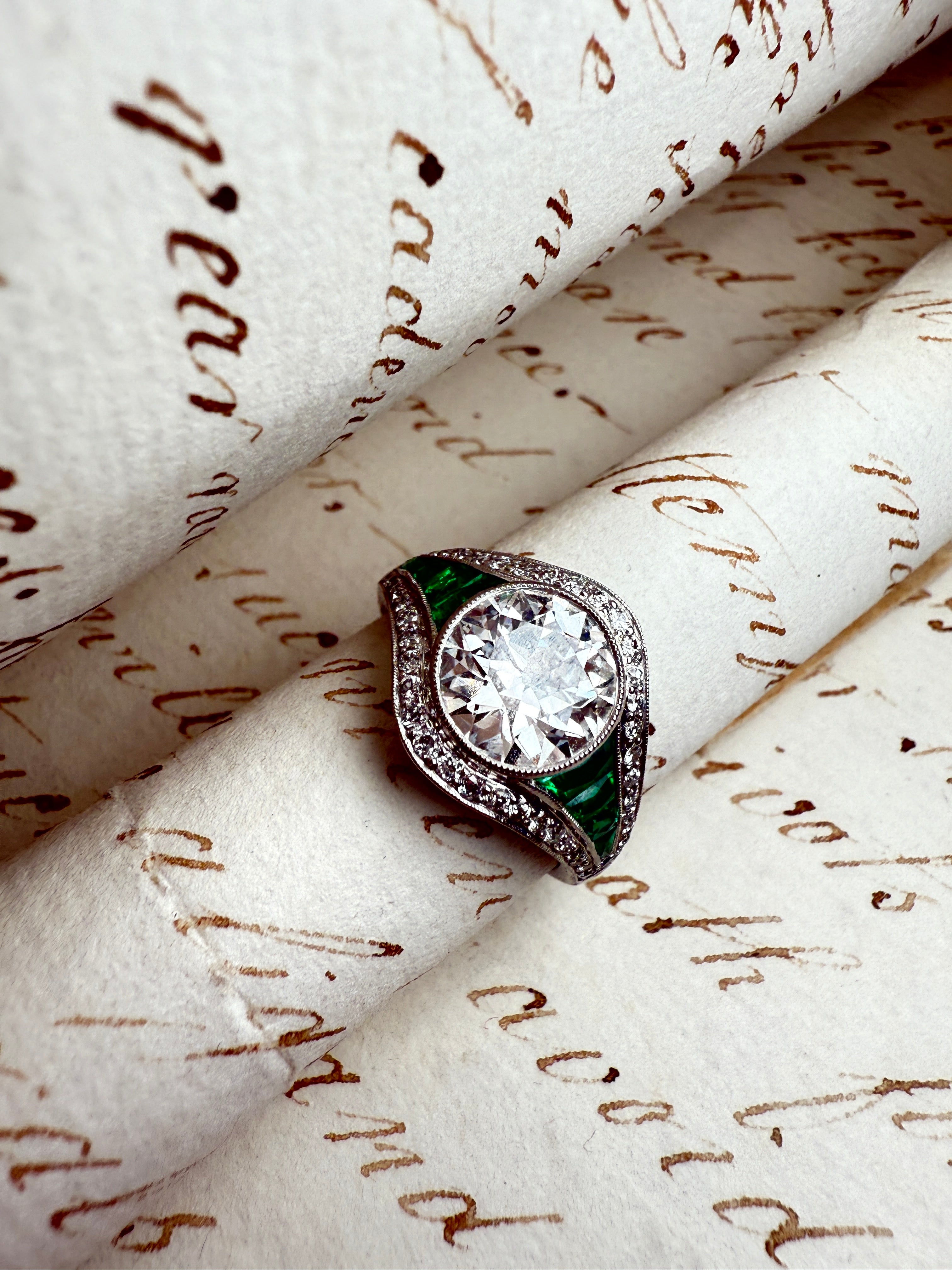 Diamond and emerald engagement ring