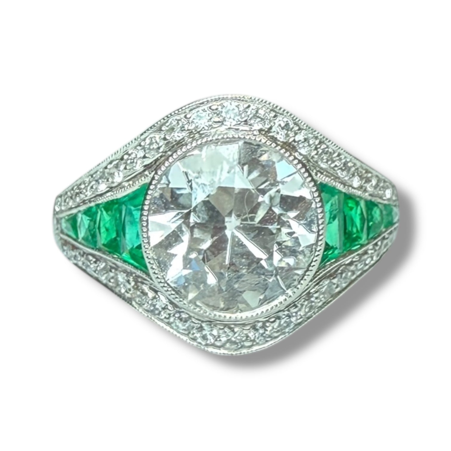 Diamond and emerald engagement ring